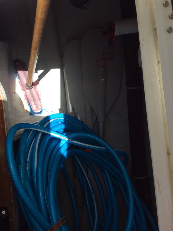 13 deck brush,oars for the dingy, water hose